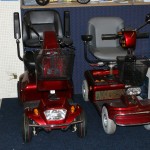 2 red second hand mobility scooters from Linchris Mobility Services South Wales